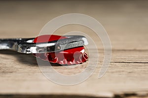 Vintage bottle opener on red bottle cap