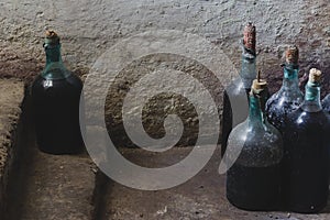 Vintage bottles of homemade wine in the cellar