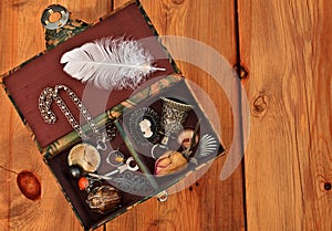 Vintage box with trinkets and women's jewelry