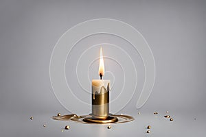 Vintage brass candelabra of a single burning candle with dripping wax on a gray background. photo created using the