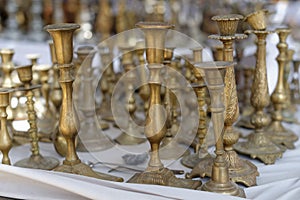 Vintage brass candlesticks at a flea market photo