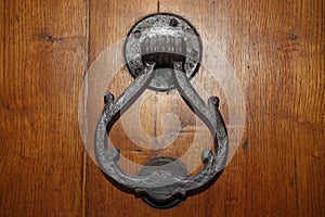 Vintage brass door knocker on an old door, Italy, Florence