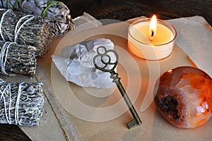 Vintage Brass Key and Lit Candle