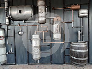 Vintage brewing equipment on a gray wall