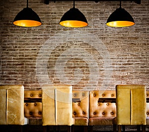 Vintage brick wall with pendant luminaires