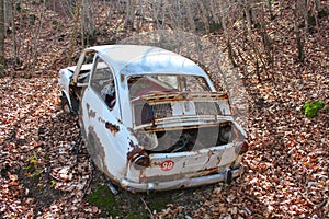 Vintage broken car in a forest
