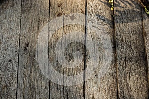 Vintage brown barrel wooden planks background texture with scratches and black stains over wood grain of old aged oak