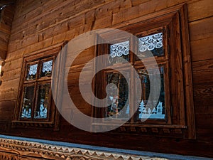 Vintage brown country wooden window. Antique traditional building exterior detail. Travel photo. Retro rustic wood board