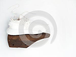 Vintage brown moulds wooden shoe model on white background