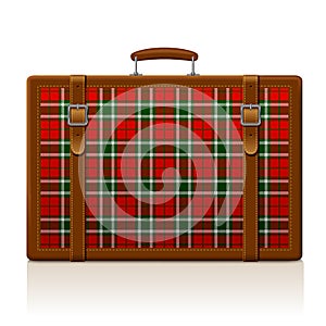 Vintage brown threadbare suitcase with tartan ornament