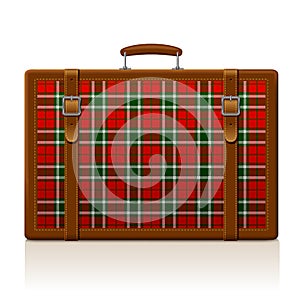 Vintage brown threadbare suitcase with tartan ornament photo