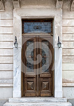 Vintage brown wooden old door in the centre of Athens in Greece