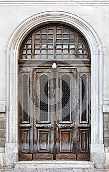 Vintage brown wooden old door in the centre of Athens in Greece