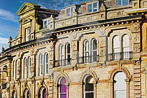 Vintage building corner against a dramatic cloudy sky in Harrogate, England