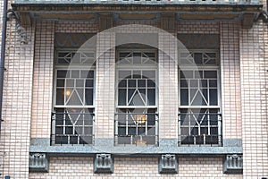 Vintage building facade with geometric window grid pattern