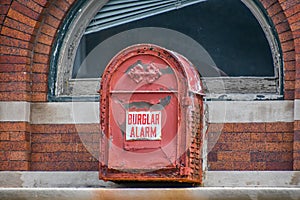 Vintage Burglar Alarm on Brick Building