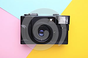 Vintage camera on colorful background. Old photo camera on background