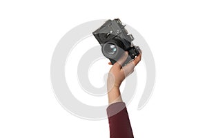 Vintage camera in hand isolated on white background. Photography and memories