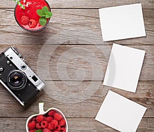 Vintage camera, photos and raspberry smoothie