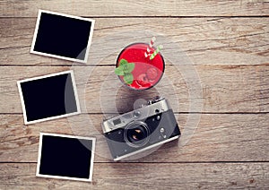 Vintage camera, photos and raspberry smoothie