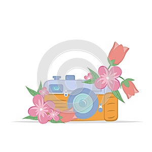 Vintage camera with tender pink flower.  on a white background