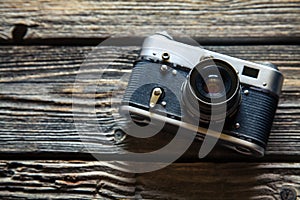 Vintage camera on wooden background