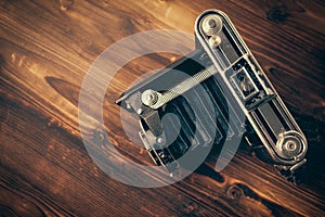 Vintage camera on wooden background