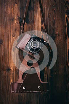 Vintage camera on wooden background