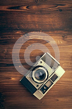 Vintage camera on wooden background