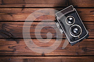 Vintage camera on wooden background