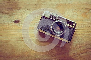 Vintage camera on wooden background