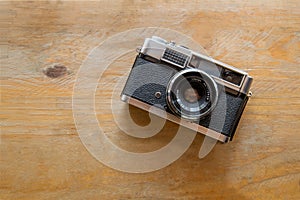 Vintage camera on wooden background