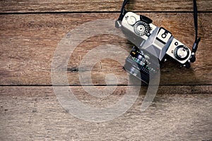 Vintage camera on wooden background