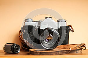 Vintage camera on a wooden table