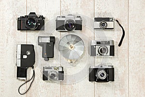 Vintage Cameras With Flash On Floorboard