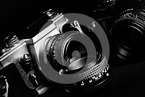 Vintage cameras and lenses on a black background