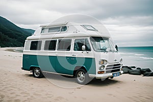 A vintage camper van parked by the beach