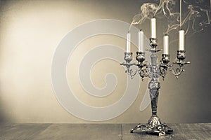 Vintage candelabrum with five reek candles sepia photo photo