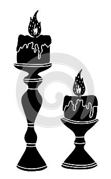 Vintage candles with a burning fire, black vector illustration.