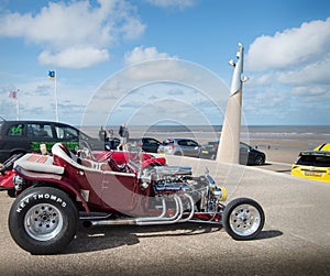 Vintage car by the beach in the UK