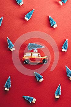 Vintage car with Christmas tree on roof. Retro Merry Christmas and Happy New Year poster, postcard template