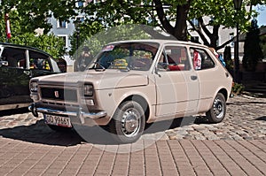 Vintage veteran old classic compact Italian car Fiat 127 parked