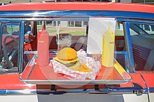 Vintage car with food tray on window