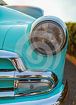 Vintage Car Front Detail. Classic car headlights close-up. Headlights of yellow vintage car. Exhibition