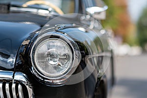 Vintage car headlights closeup view