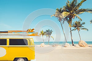 Vintage car parked with a surfboard on the roof