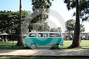 Vintage car parked on the tropical beach seaside, Classic green and white