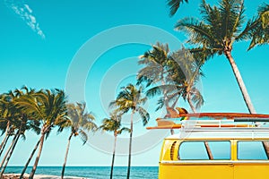 vintage car parked at the tropical beach seaside with a surfboard on the roof