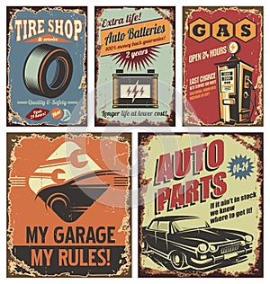 Vintage car service tin signs and posters on old rusty background photo