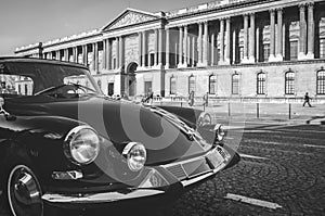 A vintage car in the streets of Paris, France, near the Louvre museum